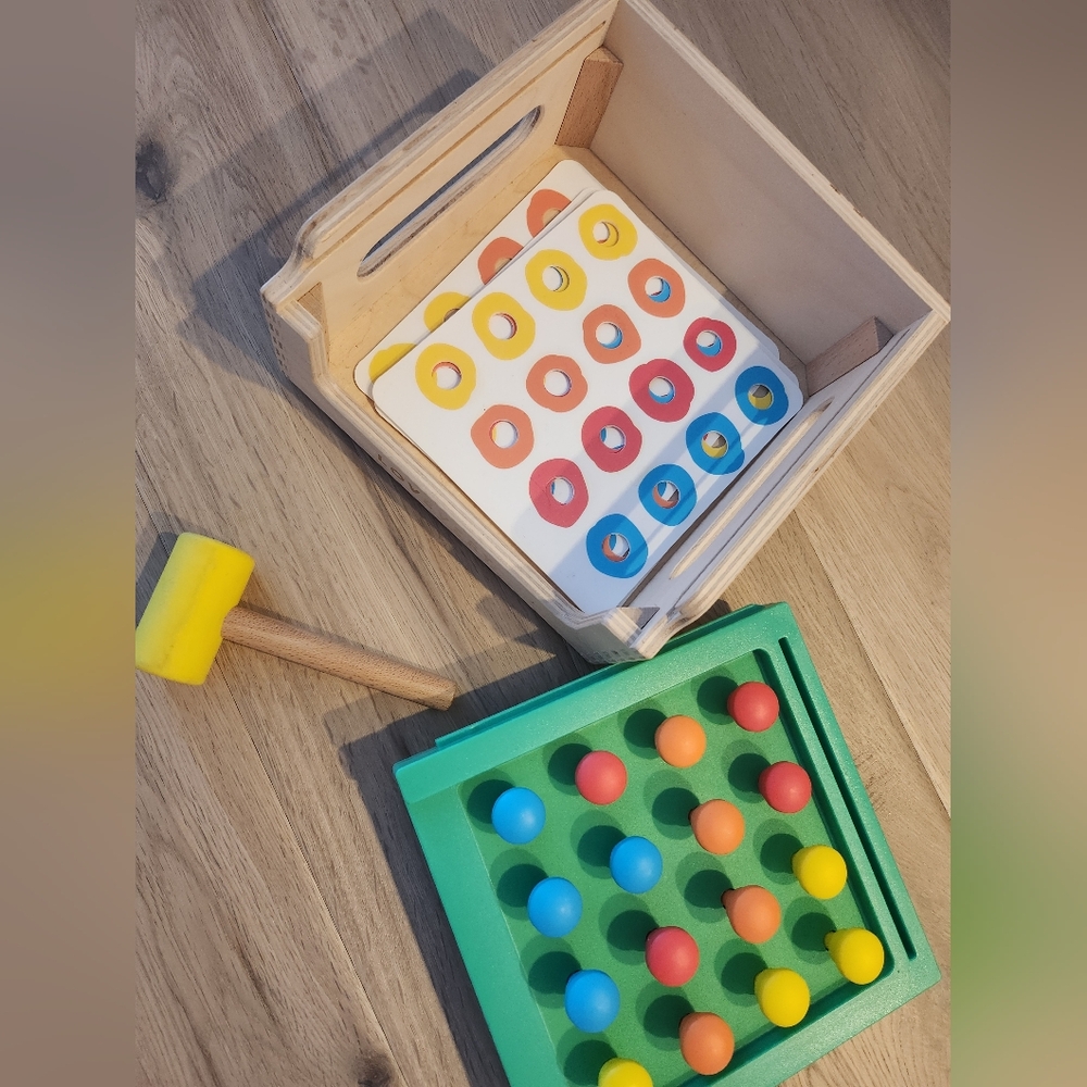Lovevery hammer and pegs toy